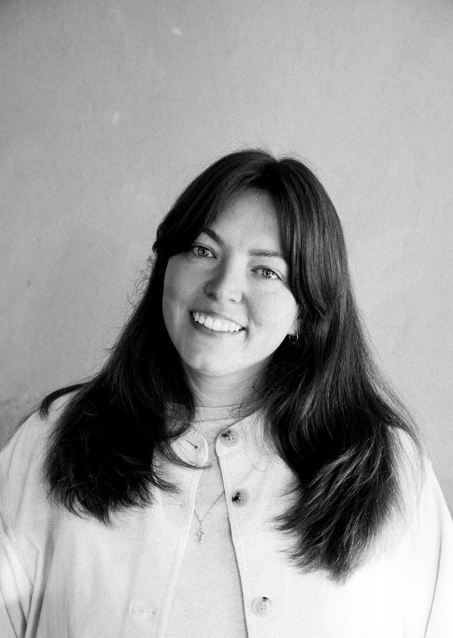 Studio headshot of a Light teammate smiling