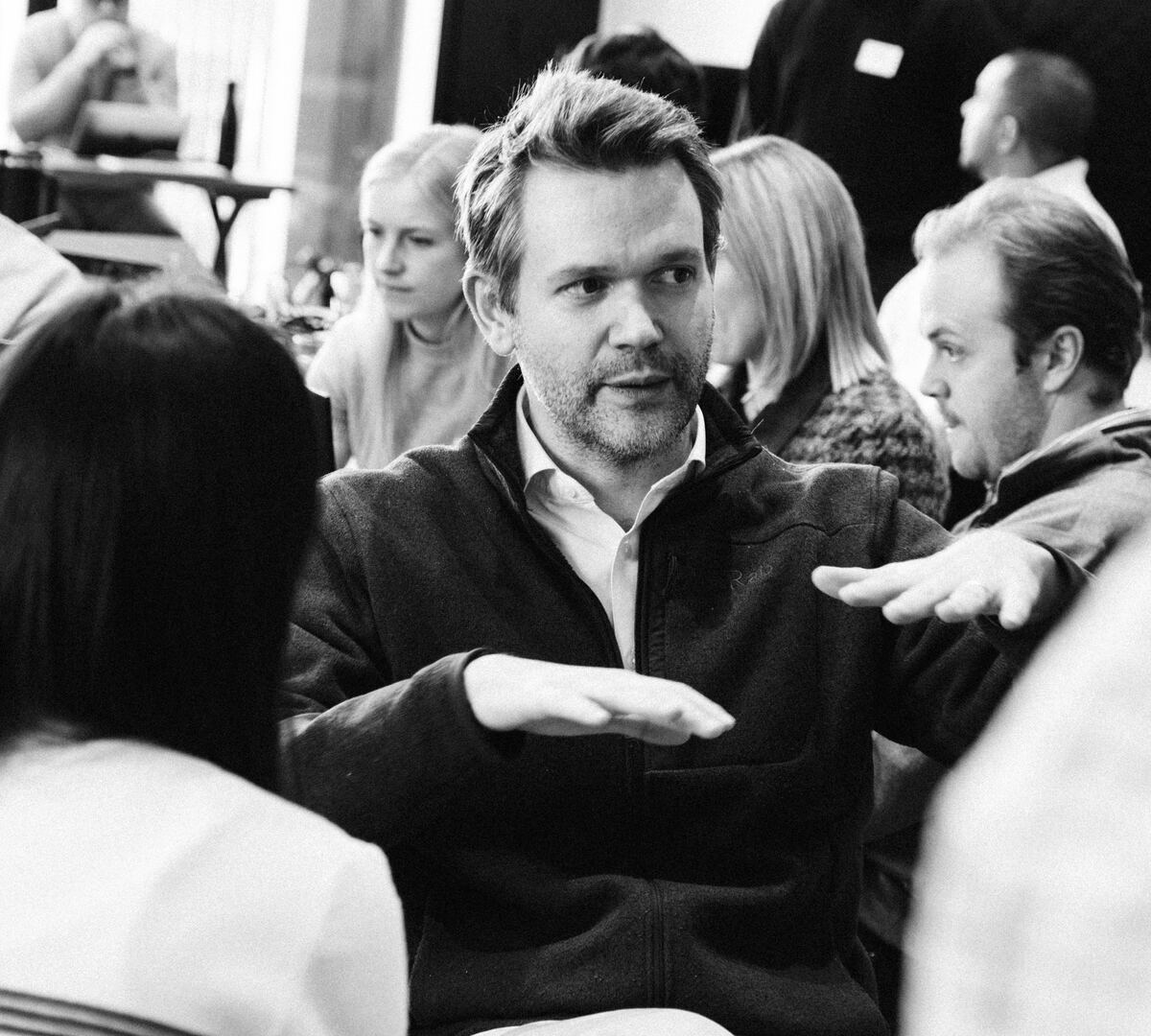 Light's founder Jonathan in conversation, making a point with his hands