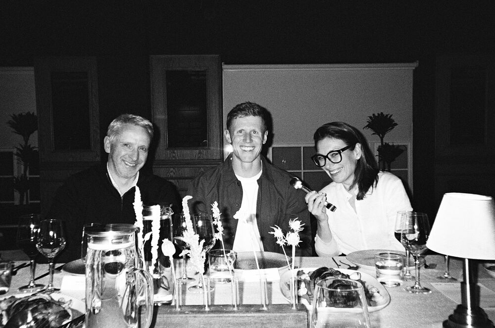 Partners at a candlelit dinner table