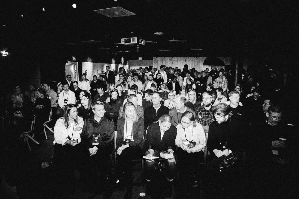 A packed crowd at a Light Finance Hackathon