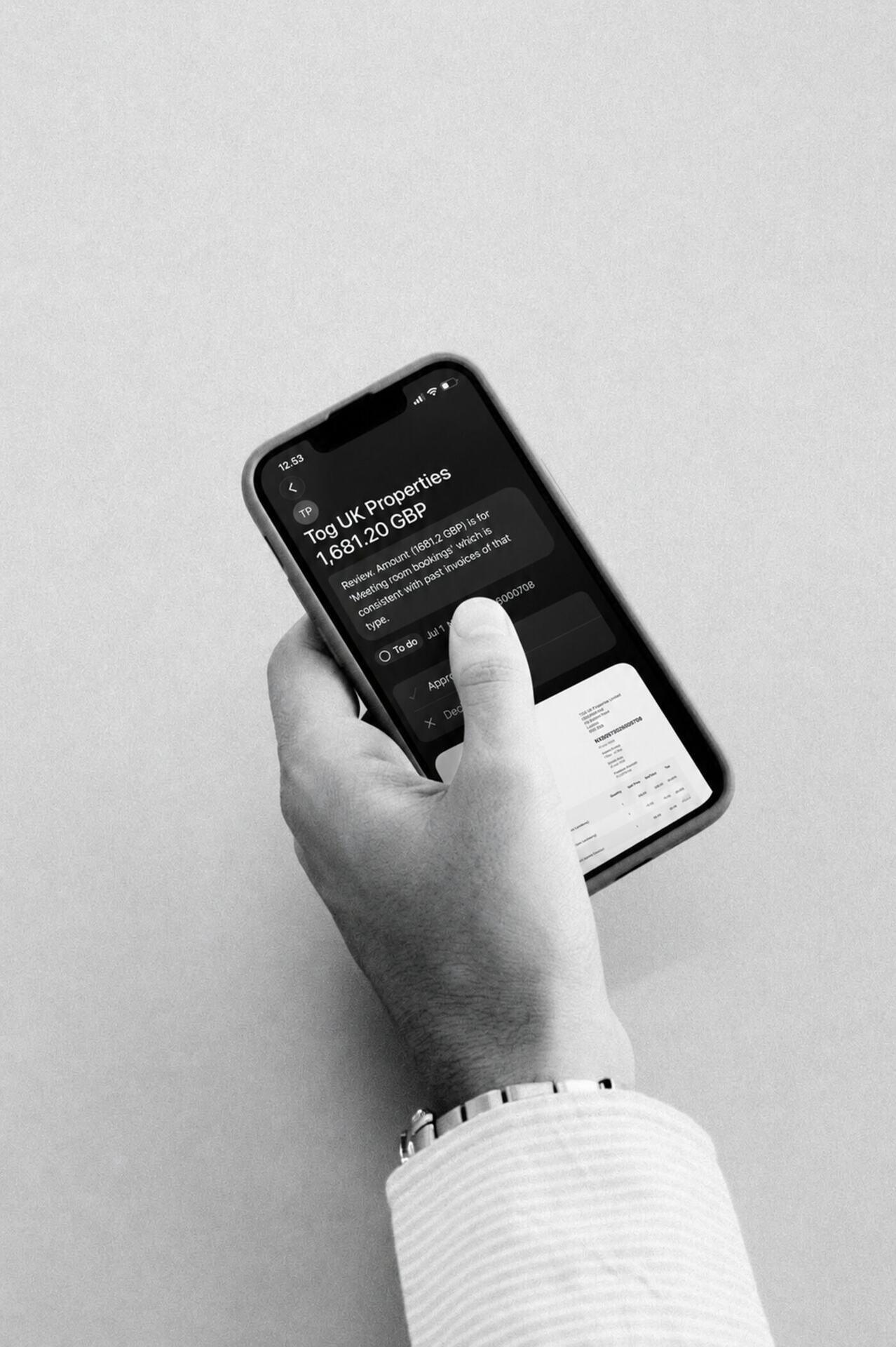 Approving an invoice in the Light mobile app, with the agent flagging the amount for review